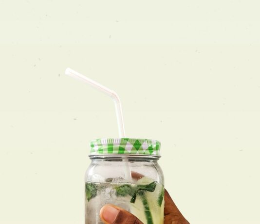 체력 향상과 체중 감량을 위한 실전 식단 전략 person holding clear glass jar with green and white lid