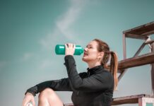 관절 건강과 노화: 나이에 맞는 운동과 관리법 woman in black shirt and black shorts holding orange basketball
